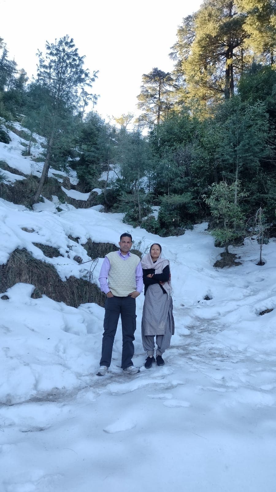 Suresh and Kusum, the hosts of Himalayan Nest, in the hills near Bir Billing